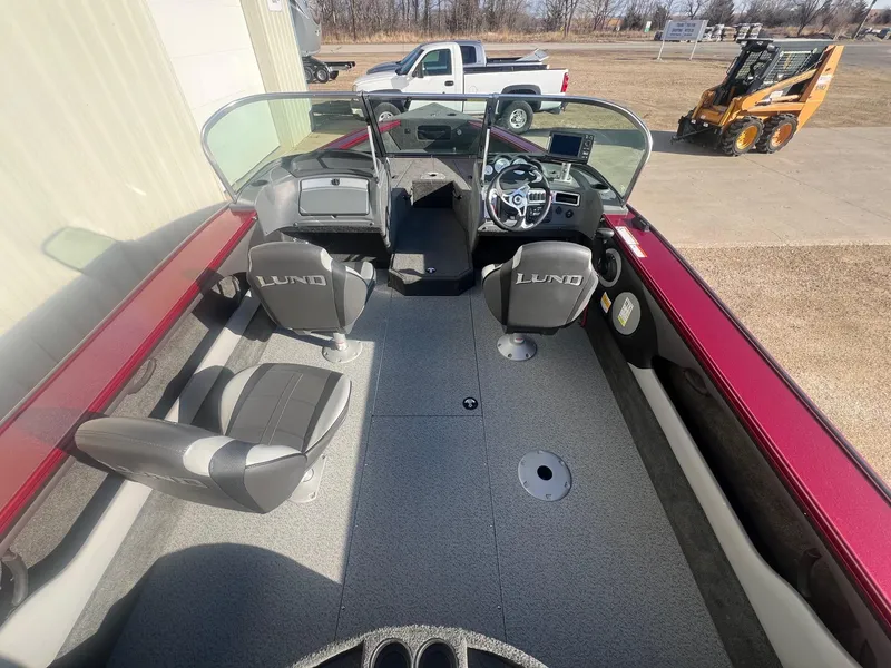 Slide: The Image of 2014 Lund 1875 Crossover XS boat interior with seating and steering console. - 11