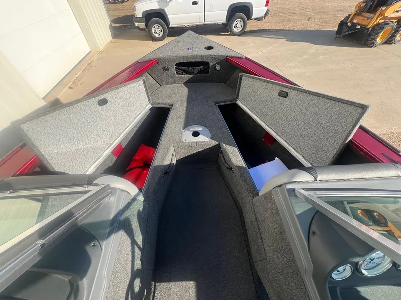 Slide: The Image of 2014 Lund 1875 Crossover XS boat interior with open storage compartments. - 12