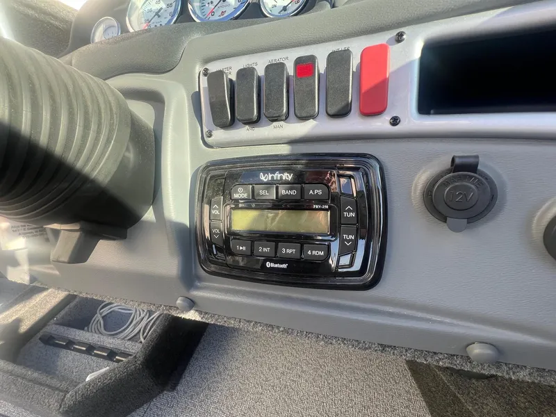 Slide: The Image of Dashboard of a 2014 Lund 1875 Crossover XS boat with Infinity stereo system. - 16