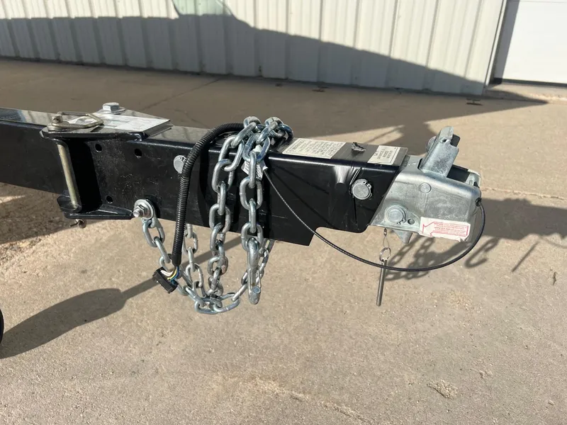 Slide: The Image of Trailer hitch of a 2014 Lund 1875 Crossover XS with safety chains and coupler. - 26