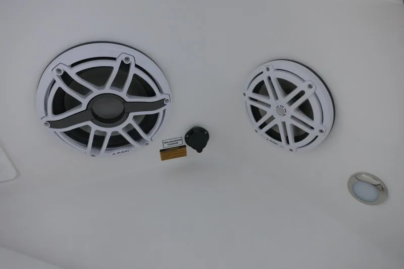 Slide: The Image of 2024 Crevalle 26 HCO boat speakers and light on white interior ceiling. - 11
