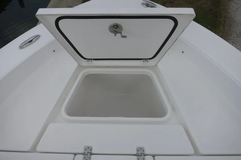 Slide: The Image of Open storage compartment on 2024 Crevalle 26 HCO boat deck. - 14