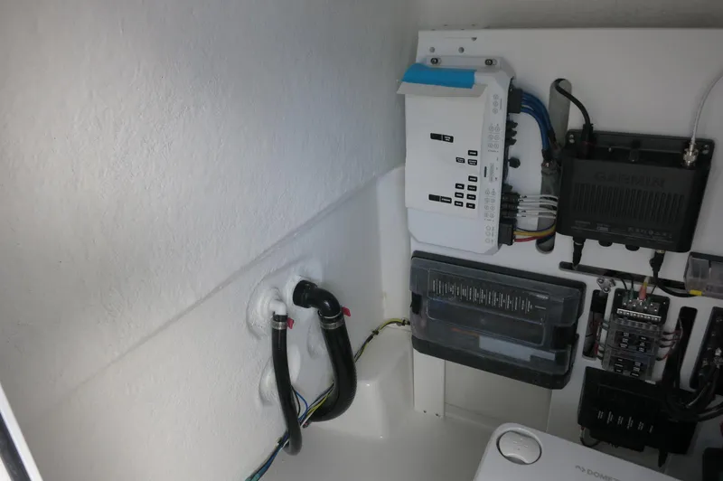 Slide: The Image of 2024 Crevalle 26 HCO boat electrical system with wiring and control panels. - 19