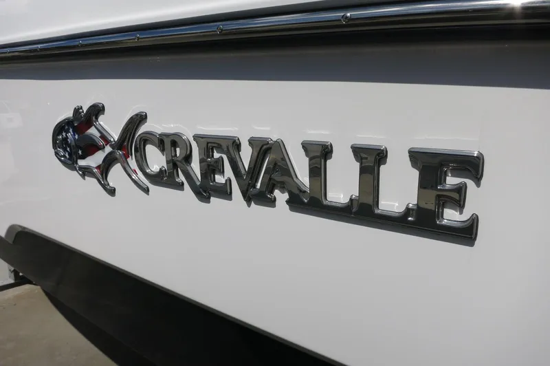 Slide: The Image of 2024 Crevalle 26 HCO boat logo on white hull. - 2