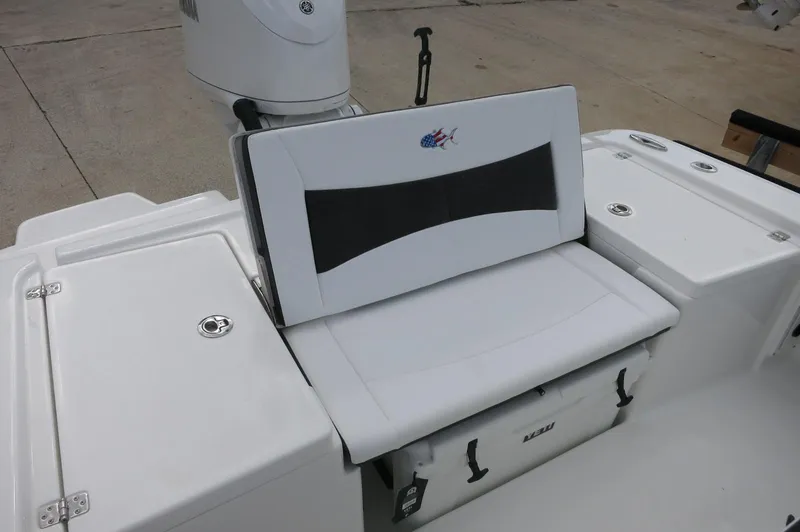 Slide: The Image of 2024 Crevalle 26 HCO boat seating area with storage compartments. - 22