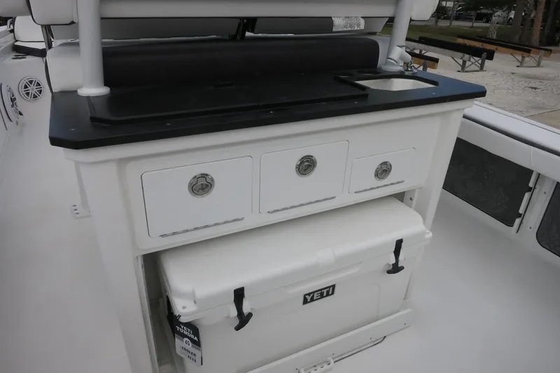 Slide: The Image of 2024 Crevalle 26 HCO boat with storage drawers and Yeti cooler. - 25