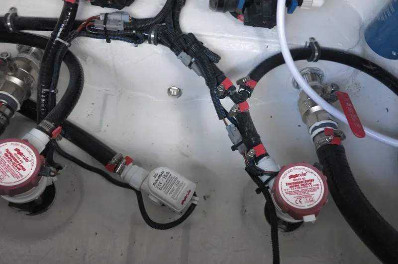 Slide: The Image of Bilge pump system in 2024 Crevalle 26 HCO boat, featuring wiring and hoses. - 29