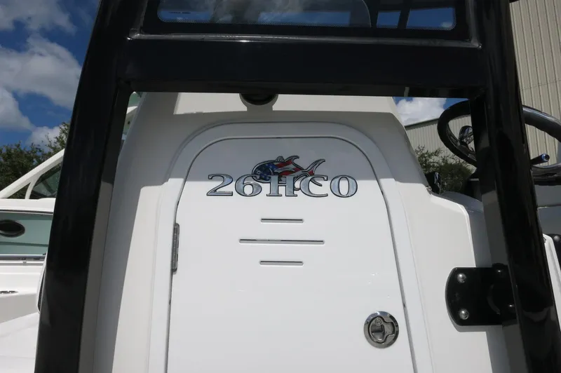 Slide: The Image of 2024 Crevalle 26 HCO boat console with logo and steering wheel. - 8