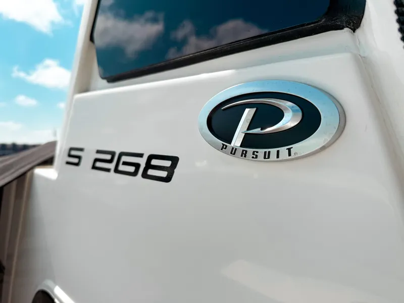 Slide: The Image of 2025 Pursuit S 268 Sport boat emblem and model detail. - 2