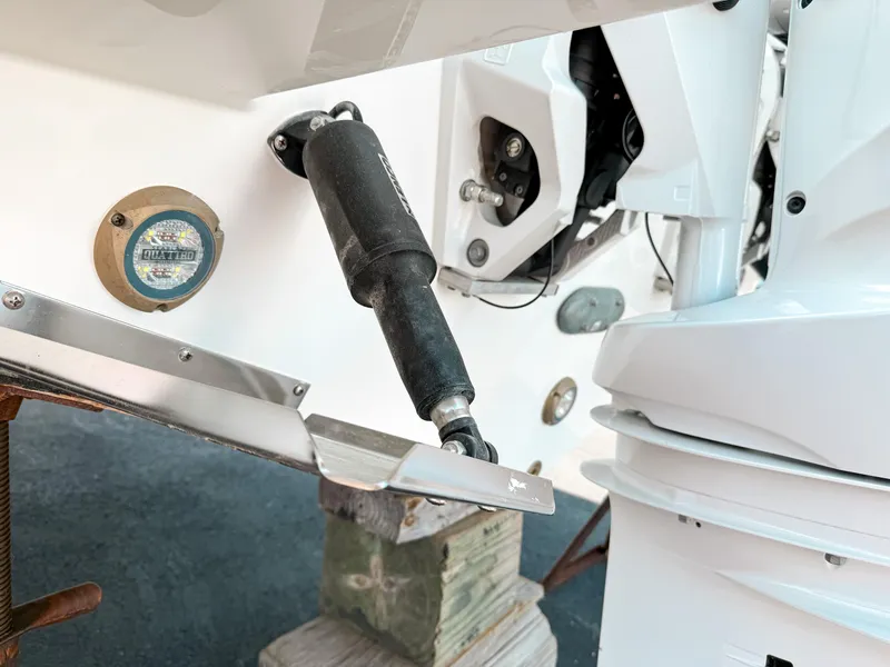 Slide: The Image of 2025 Pursuit S 268 Sport boat engine and trim tab detail. - 26