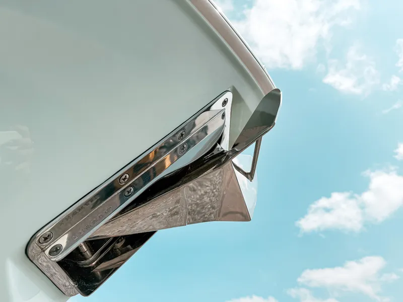Slide: The Image of 2025 Pursuit S 268 Sport boat anchor detail against blue sky. - 3