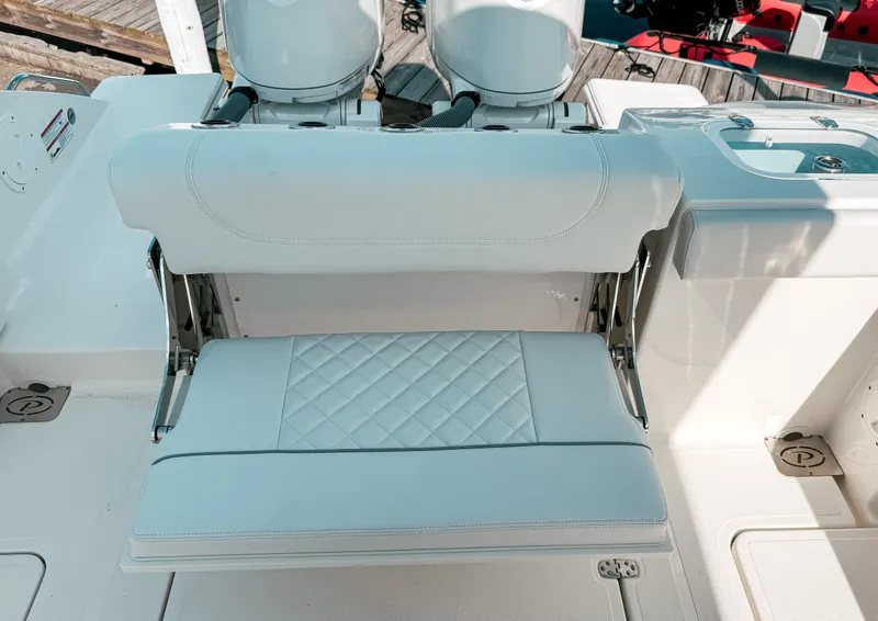 Slide: The Image of 2025 Pursuit S 268 Sport boat with foldable seating and dual engines. - 9