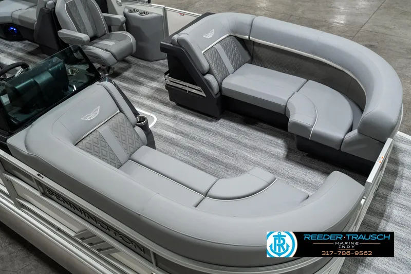 Slide: The Image of 2025 Bennington 22 MFB pontoon boat interior with luxurious gray seating and modern design. - 10
