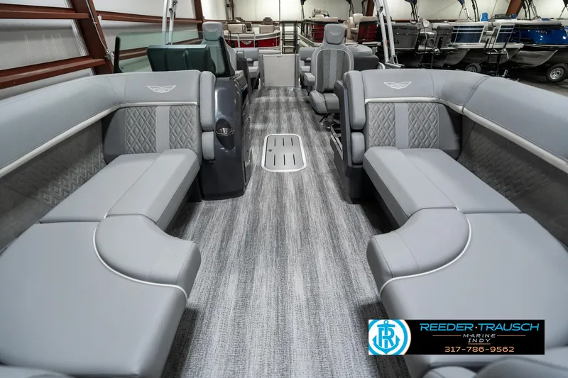 Slide: The Image of 2025 Bennington 22 MFB pontoon boat interior with gray seating and carpet flooring. - 13