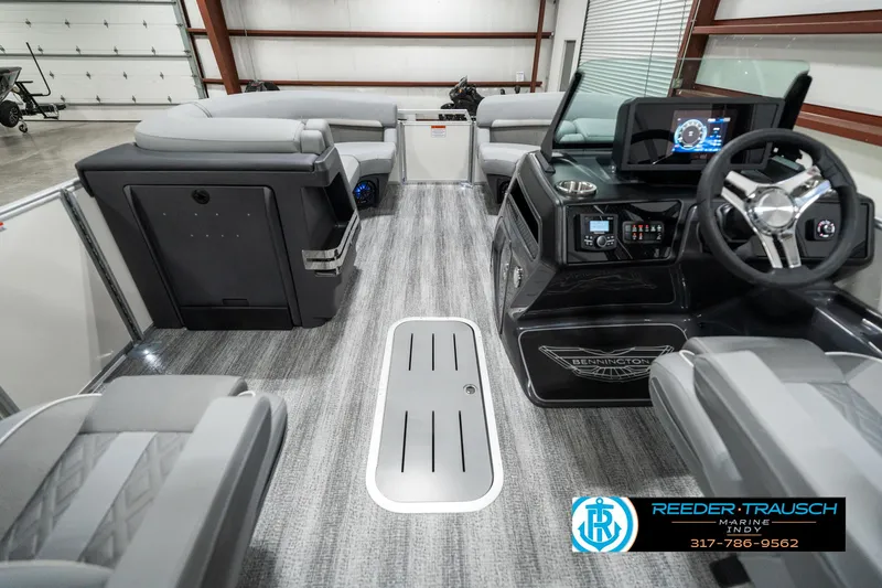 Slide: The Image of 2025 Bennington 22 MFB boat interior with modern dashboard and seating. - 17