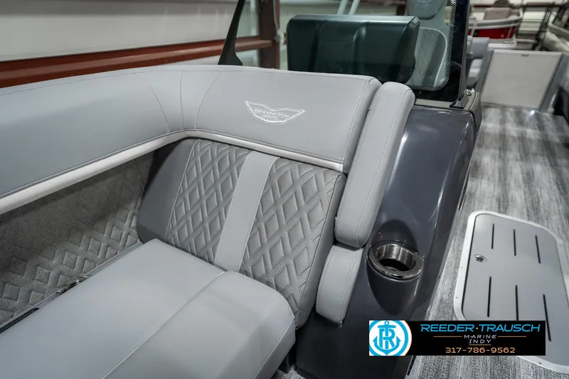 Slide: The Image of 2025 Bennington 22 MFB boat interior with gray quilted seating and cup holder. - 20