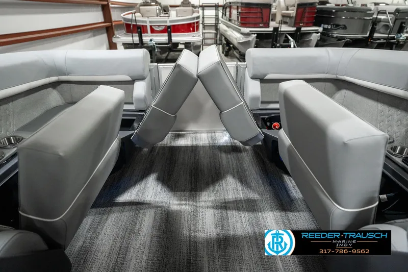 Slide: The Image of 2025 Bennington 22 MFB interior with gray seating and carpeted flooring. - 25