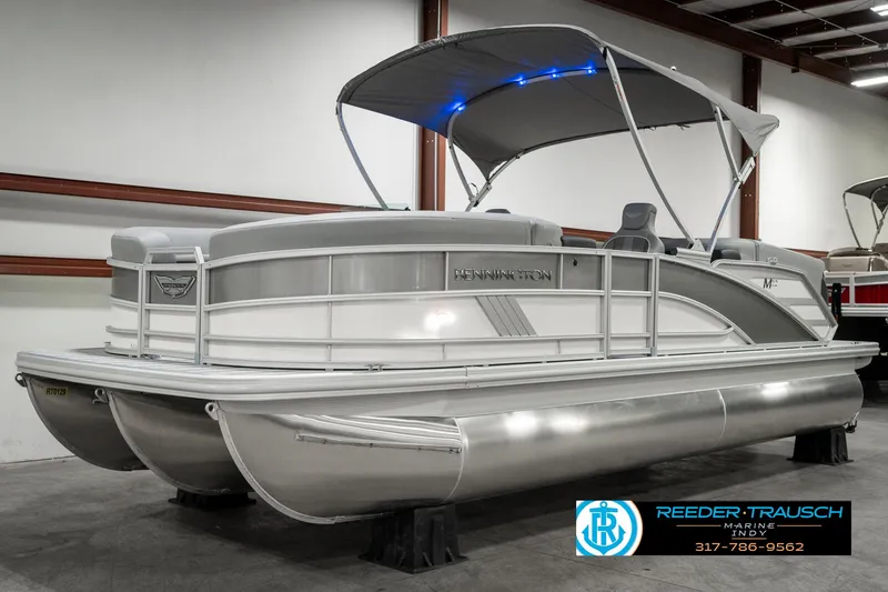 Slide: The Image of 2025 Bennington 22 MFB pontoon boat with canopy in showroom. - 3