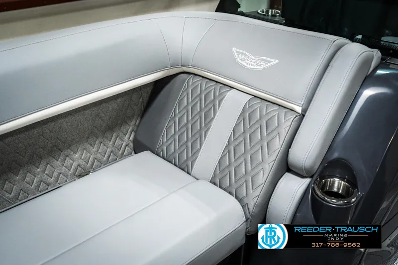 Slide: The Image of 2025 Bennington 22 MFB boat interior with luxurious gray seating and diamond stitching. - 34