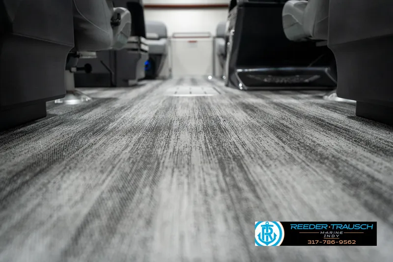 Slide: The Image of 2025 Bennington 22 MFB interior with modern flooring and seating. - 39