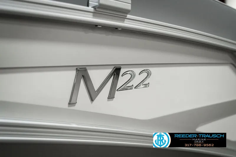 Slide: The Image of 2025 Bennington 22 MFB boat with M22 emblem, Reeder-Trausch logo visible. - 42