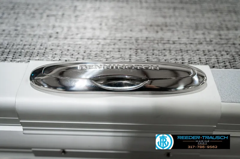 Slide: The Image of 2025 Bennington 22 MFB boat detail with chrome accent and textured background. - 46