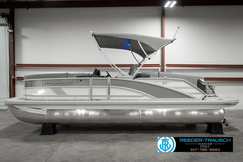Slide: The Image of 2025 Bennington 22 MFB pontoon boat with canopy in showroom. - 5