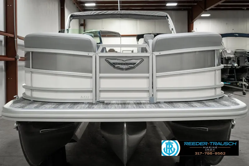 Slide: The Image of 2025 Bennington 22 MFB pontoon boat in showroom, rear view. - 8
