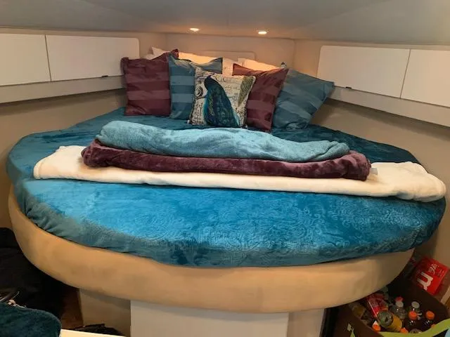 Slide: The Image of Cozy bedroom in 1994 Silverton 34 Express boat with colorful bedding and pillows. - 18
