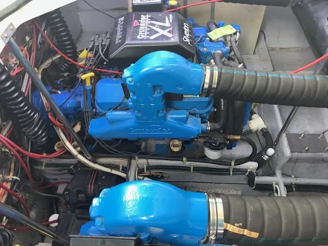 Slide: The Image of Engine compartment of a 1994 Silverton 34 Express boat, featuring blue components and wiring. - 23