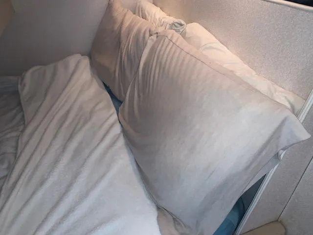 Slide: The Image of Interior cabin bed with pillows on a 1994 Silverton 34 Express boat. - 30