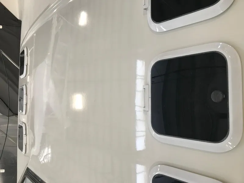 Slide: The Image of 1994 Silverton 34 Express boat windows and deck, showcasing sleek design and craftsmanship. - 6