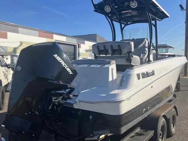 Slide: The Image of 2021 Wellcraft 222 Fisherman boat with Mercury engine, parked outdoors. - 3