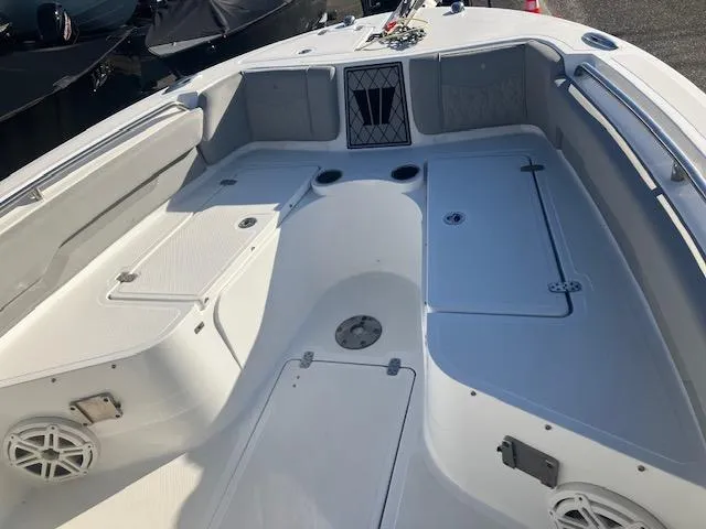 Slide: The Image of 2021 Wellcraft 222 Fisherman boat interior with spacious seating and storage compartments. - 5