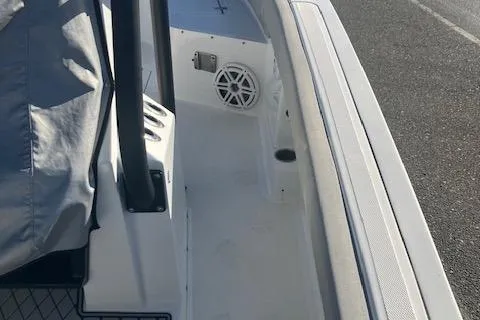 Slide: The Image of 2021 Wellcraft 222 Fisherman boat interior with speaker and covered console. - 8