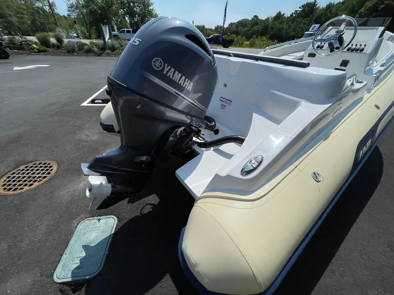 Slide: The Image of 2025 AB Inflatables Nautilus 17 DLX with Yamaha outboard motor, parked on asphalt. - 16