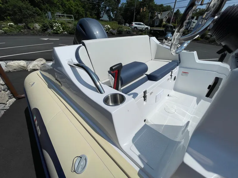 Slide: The Image of 2025 AB Inflatables Nautilus 17 DLX boat interior with seating and steering wheel. - 20