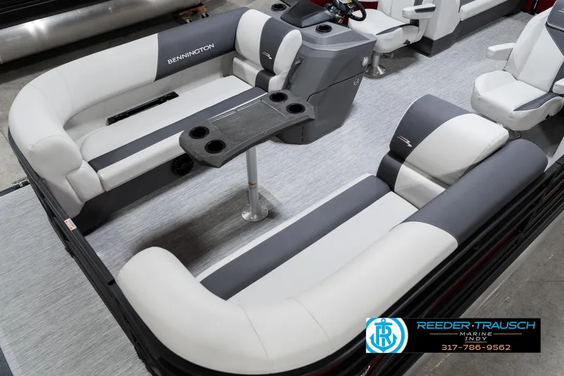 Slide: The Image of 2025 Bennington 22 SSR pontoon boat interior with gray seating and table. - 12