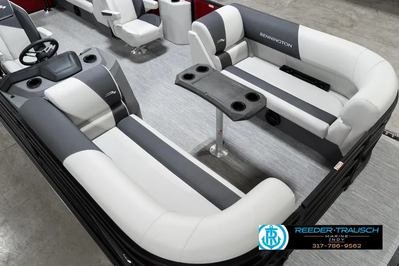 Slide: The Image of 2025 Bennington 22 SSR pontoon boat interior with gray and white seating and table. - 13