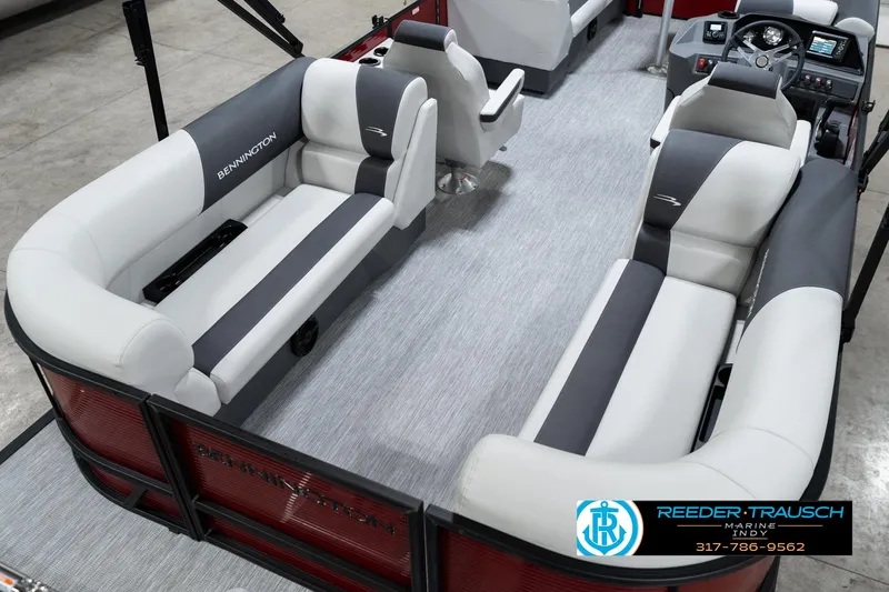 Slide: The Image of 2025 Bennington 22 SSR pontoon boat interior with gray and white seating, steering console, and carpeted floor. - 14