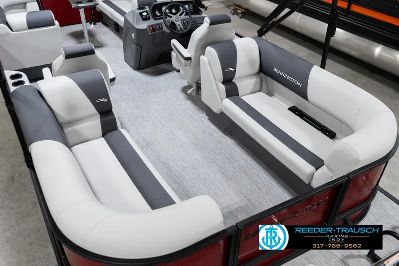 Slide: The Image of 2025 Bennington 22 SSR pontoon boat interior with plush seating and modern dashboard. - 15