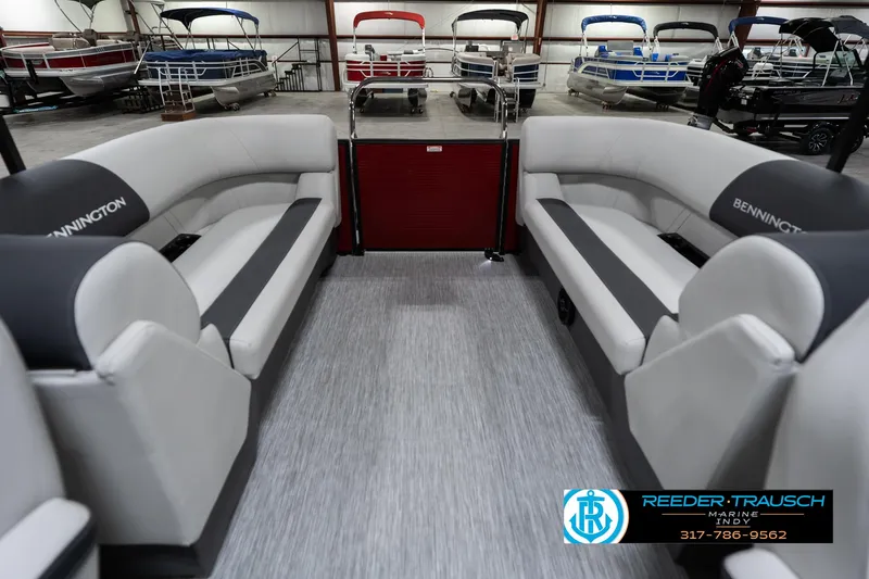 Slide: The Image of 2025 Bennington 22 SSR pontoon boat interior with gray seating in showroom. - 18