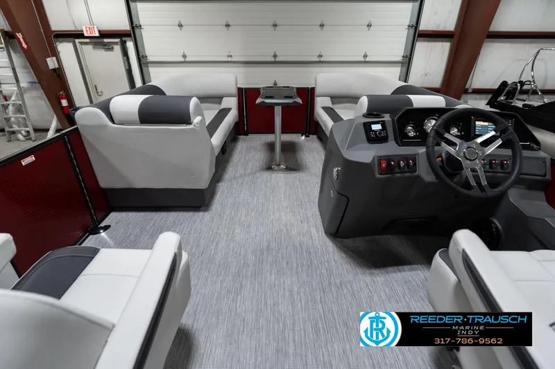 Slide: The Image of 2025 Bennington 22 SSR pontoon boat interior with modern seating and steering console. - 20
