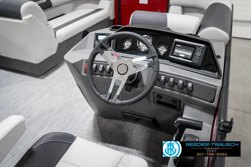 Slide: The Image of 2025 Bennington 22 SSR boat dashboard with steering wheel and control panel. - 28