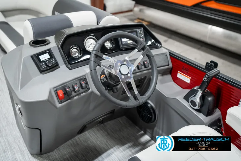 Slide: The Image of 2025 Bennington 22 SSR boat dashboard with steering wheel and control panel. - 29
