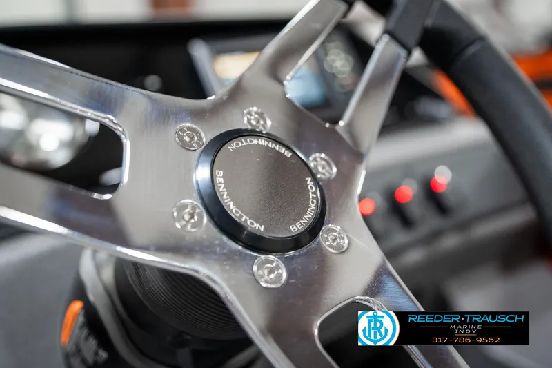 Slide: The Image of Steering wheel of 2025 Bennington 22 SSR boat, featuring sleek metallic design. - 30