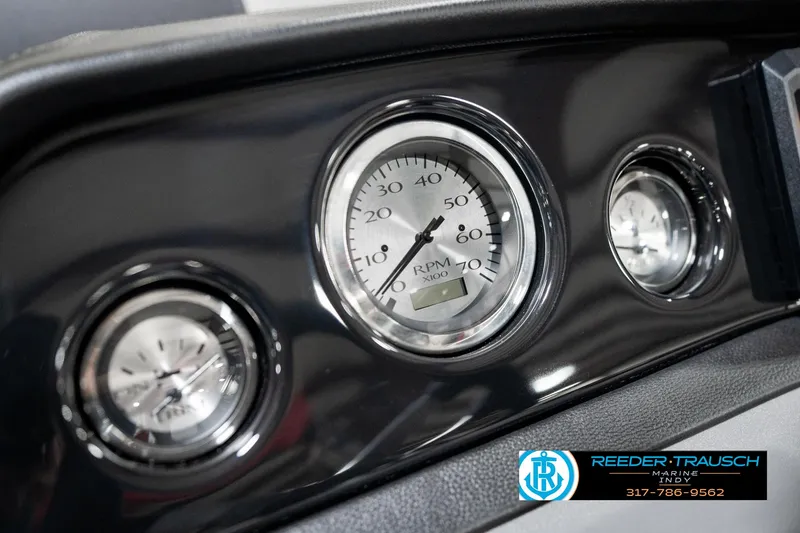 Slide: The Image of Dashboard gauges of 2025 Bennington 22 SSR boat, featuring RPM and speed indicators. - 33