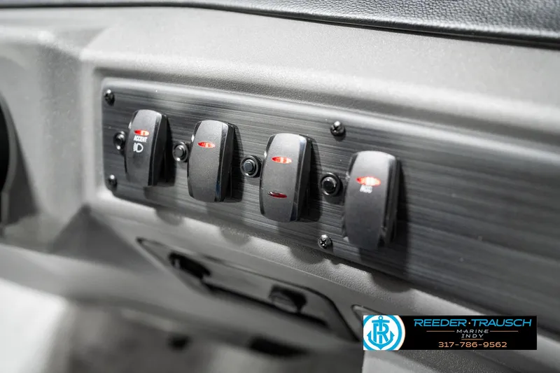 Slide: The Image of Control panel of 2025 Bennington 22 SSR boat with multiple switches. - 35