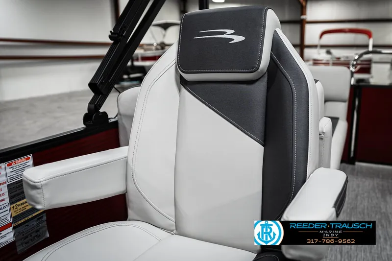 Slide: The Image of 2025 Bennington 22 SSR boat seat with sleek, modern design in a showroom setting. - 37