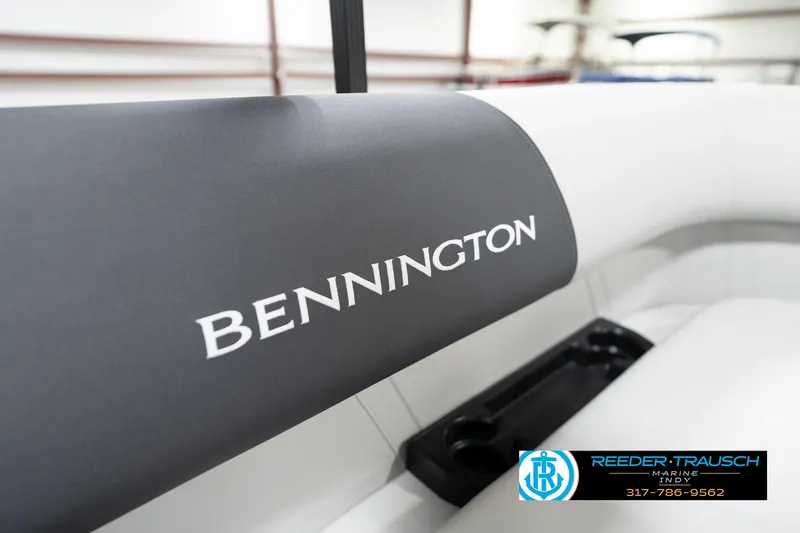 Slide: The Image of 2025 Bennington 22 SSR boat interior with logo and cup holder. - 41